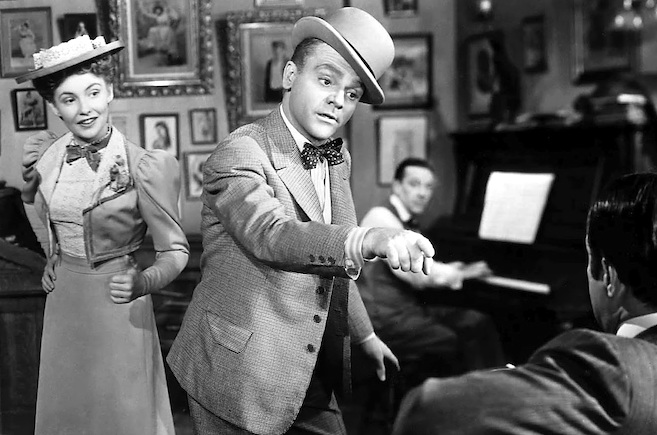 James Cagney, as George M. Cohan, brings his signature energy to this duet of  “Harrigan,” with Joan Leslie, as his soon-to-be-movie-wife, Mary, in Cohan’s biopic, Yankee Doodle Dandy (1942). Before there was Audrey Hepburn, perennially cast opposite much-older leading men, there was Joan Leslie. She was a mere 16 years old when cast opposite James Cagney, who was then 42. Yet somehow…it worked.